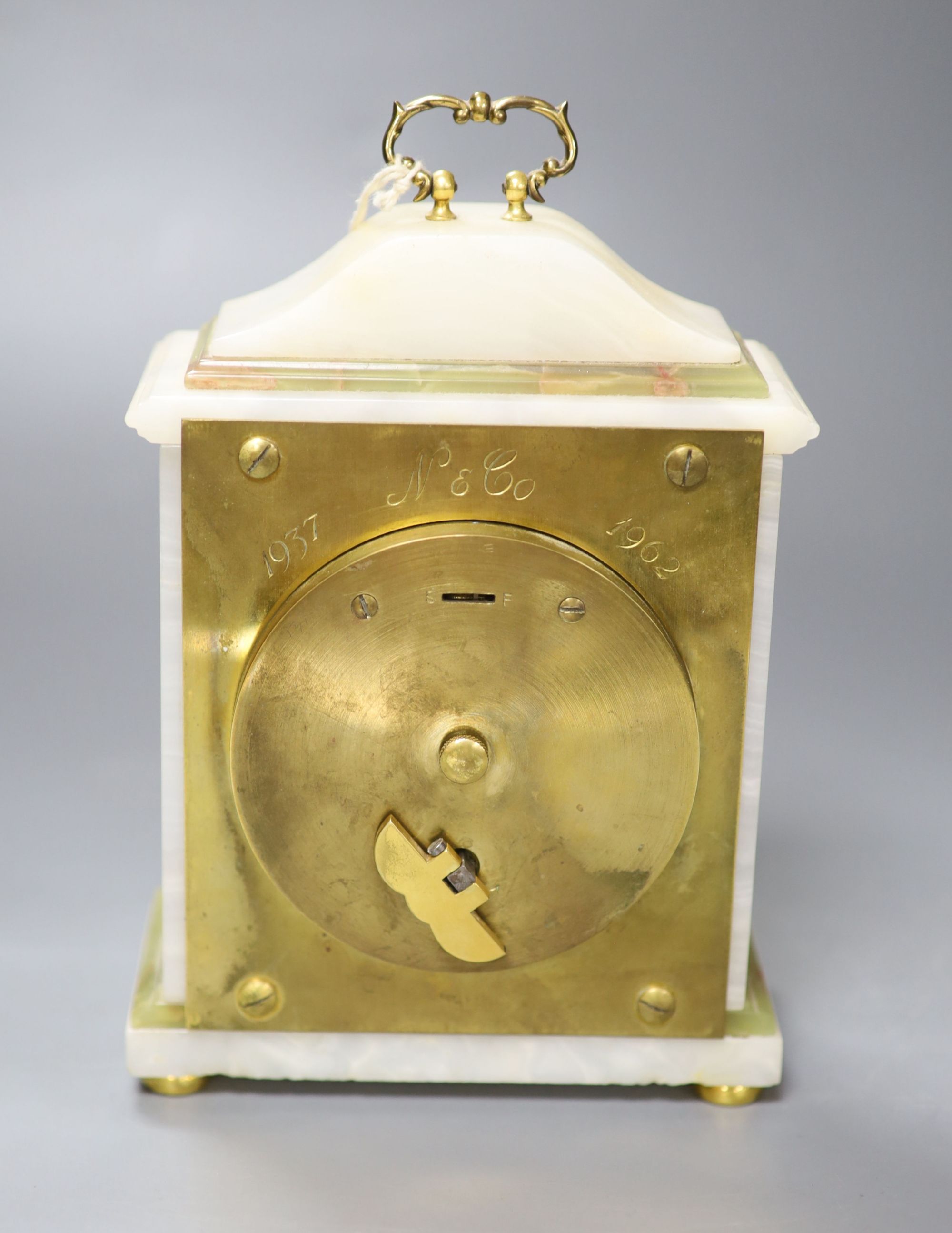 An Elliott onyx mantel clock, retailed by Asprey & Co., height 19cm